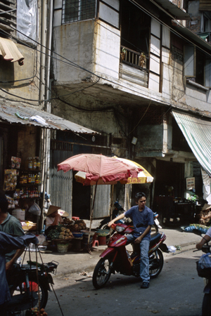 Hanoi Cyclist and Building